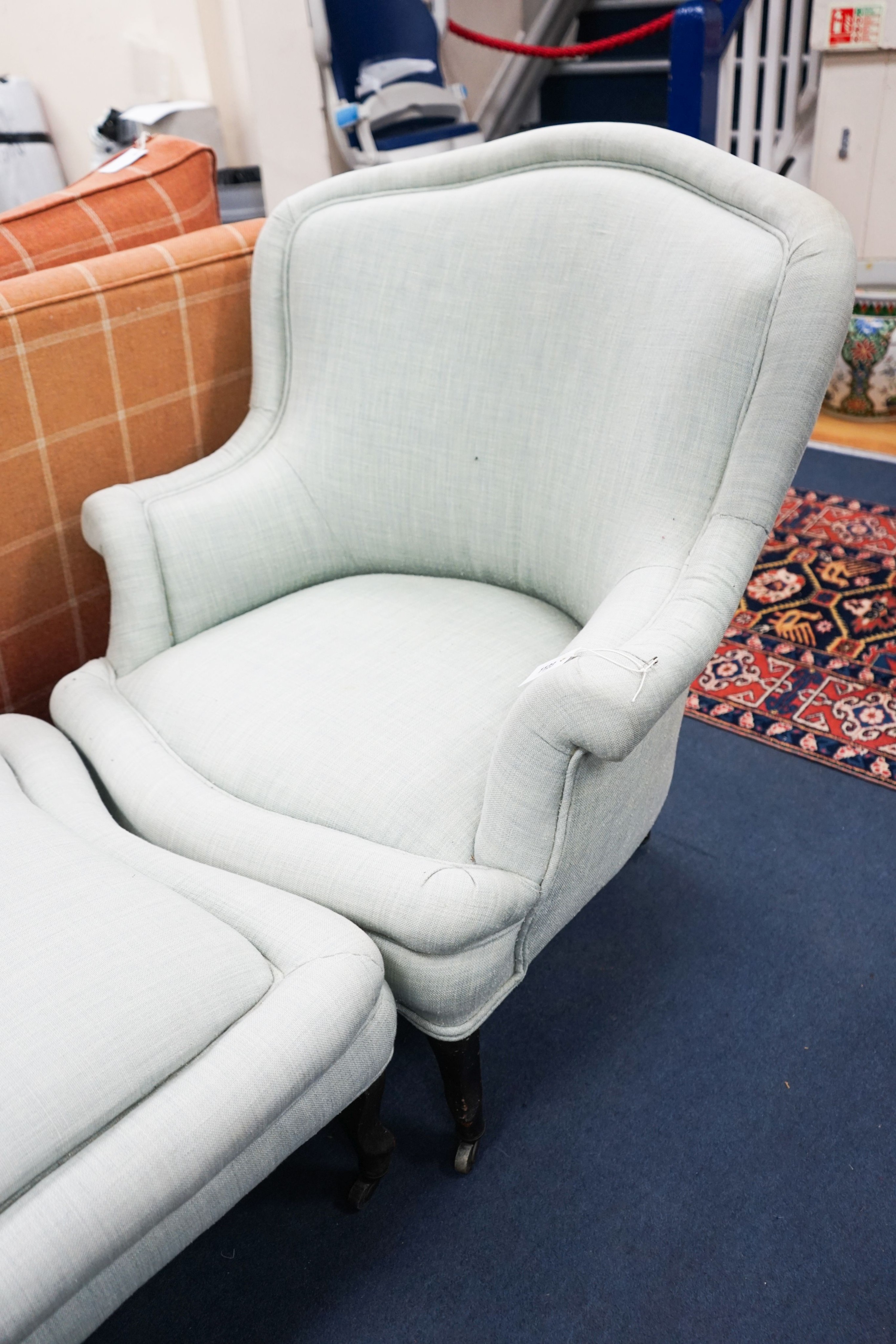 A French Duchesse Brisee comprising a pair of tub armchair and matching stool, on carved beech cabriole legs, chairs width 82cm